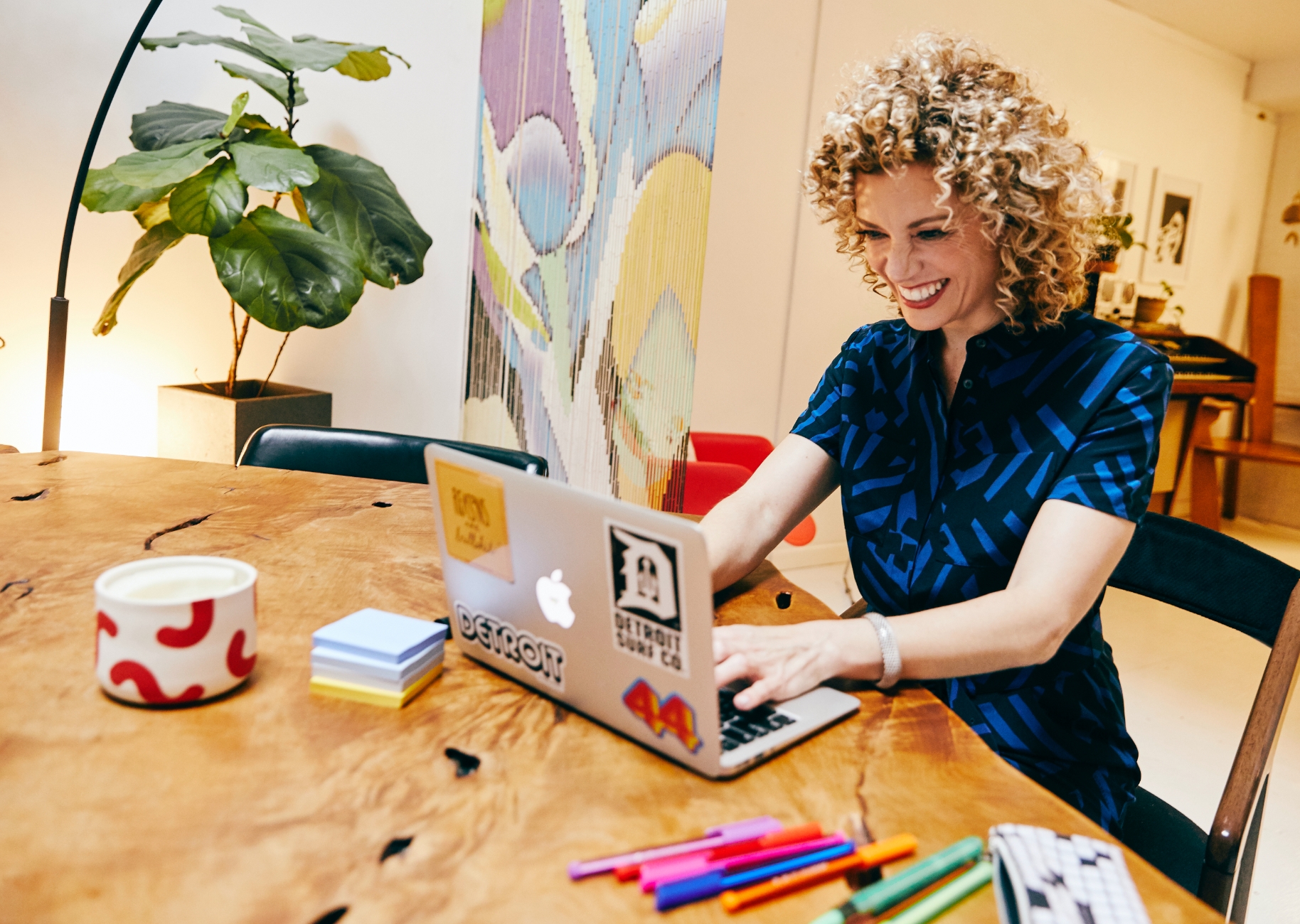 Woman Sitting at a Desk with laptop